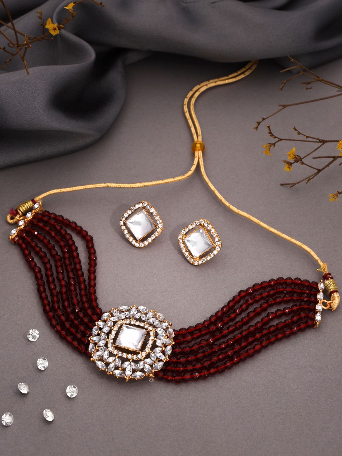 Glamorous gold choker ensemble showcasing beads